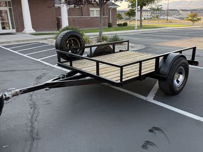 Heavy Duty Single Axle Utility Trailer with Wooden Deck and Mounted Spare Tire