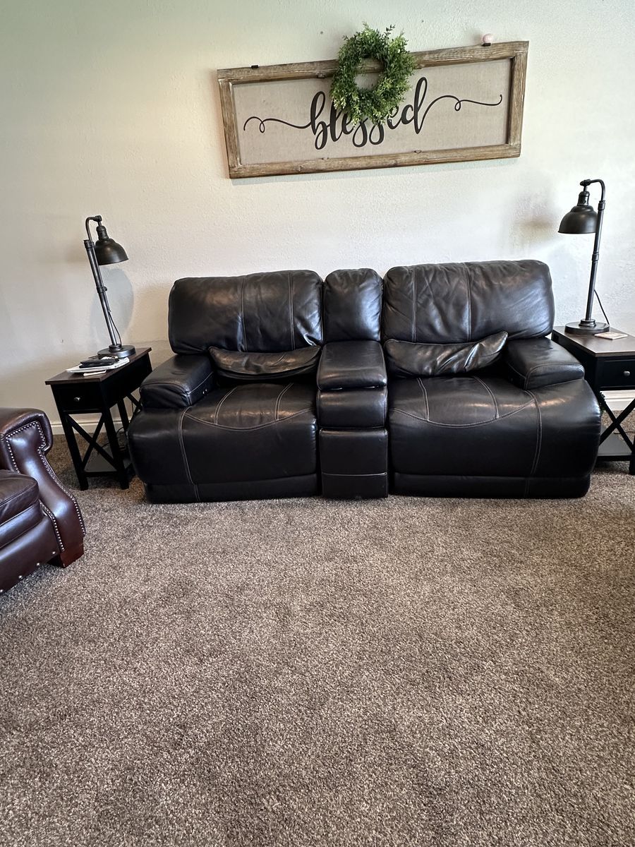 Leather Reclining Electric Love seat.