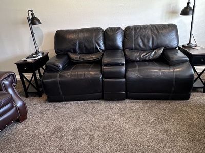 Leather Reclining Electric Love seat.