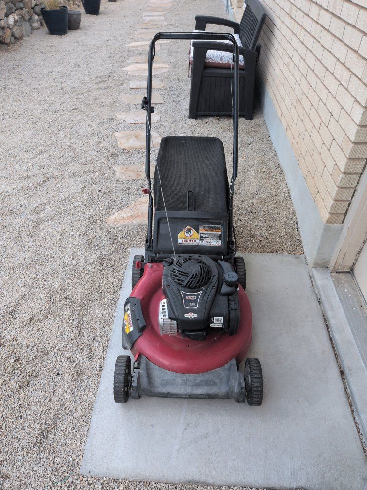 Push lawn mower with Briggs & Stratton engine. 