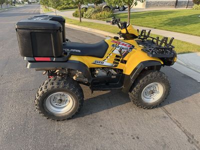 Polaris Sportsman 500 HO AWD Yellow ATV with Rear Cargo Box & Front Gun Racks