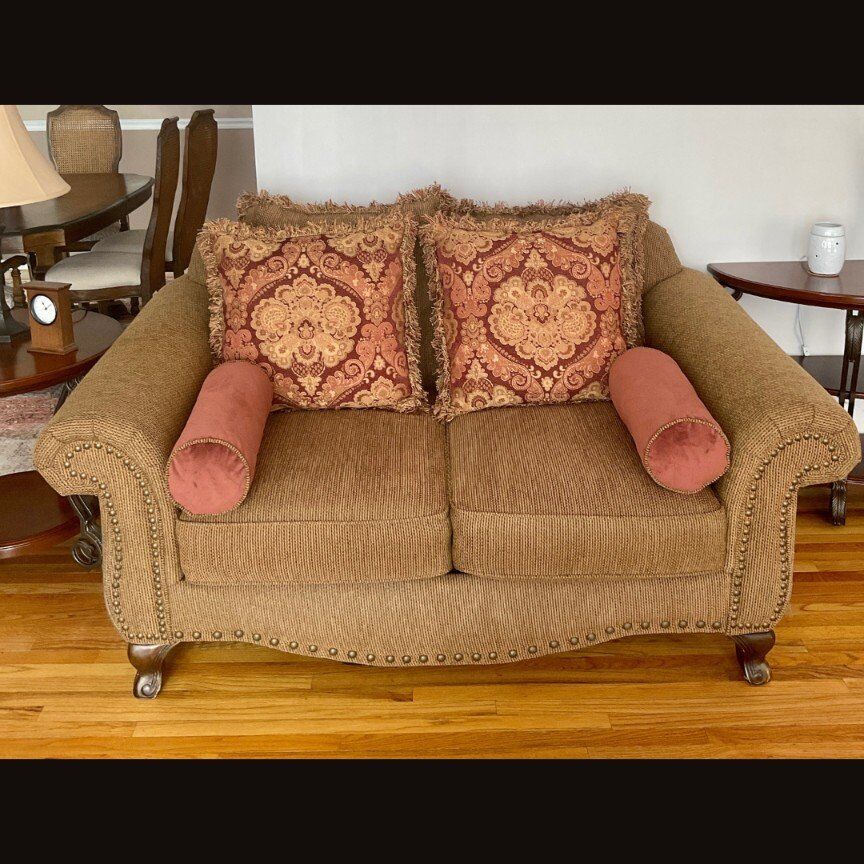 Loveseat couch with pillows
