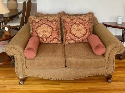 Loveseat couch with pillows