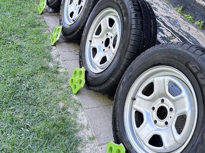 Set of 4 Goodyear Eagle Tires with Wheels and Jeep Center Caps 205/70/R16