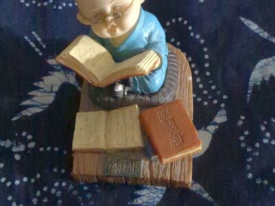 Bald monk with glasses figurine