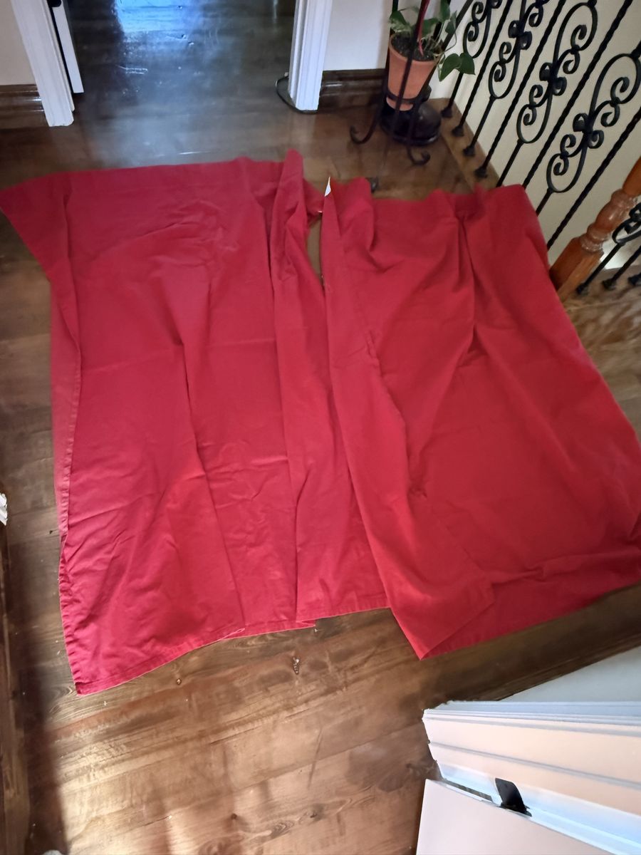 Set of 2 bright red curtains 62 L X 55 W flip side does have some fading.