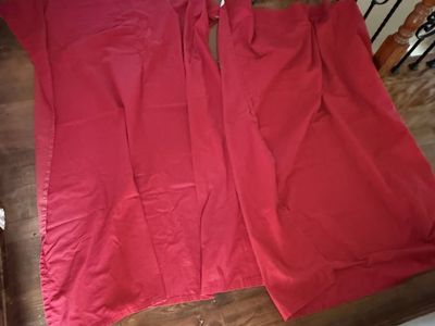 Set of 2 bright red curtains 62 L X 55 W flip side does have some fading.