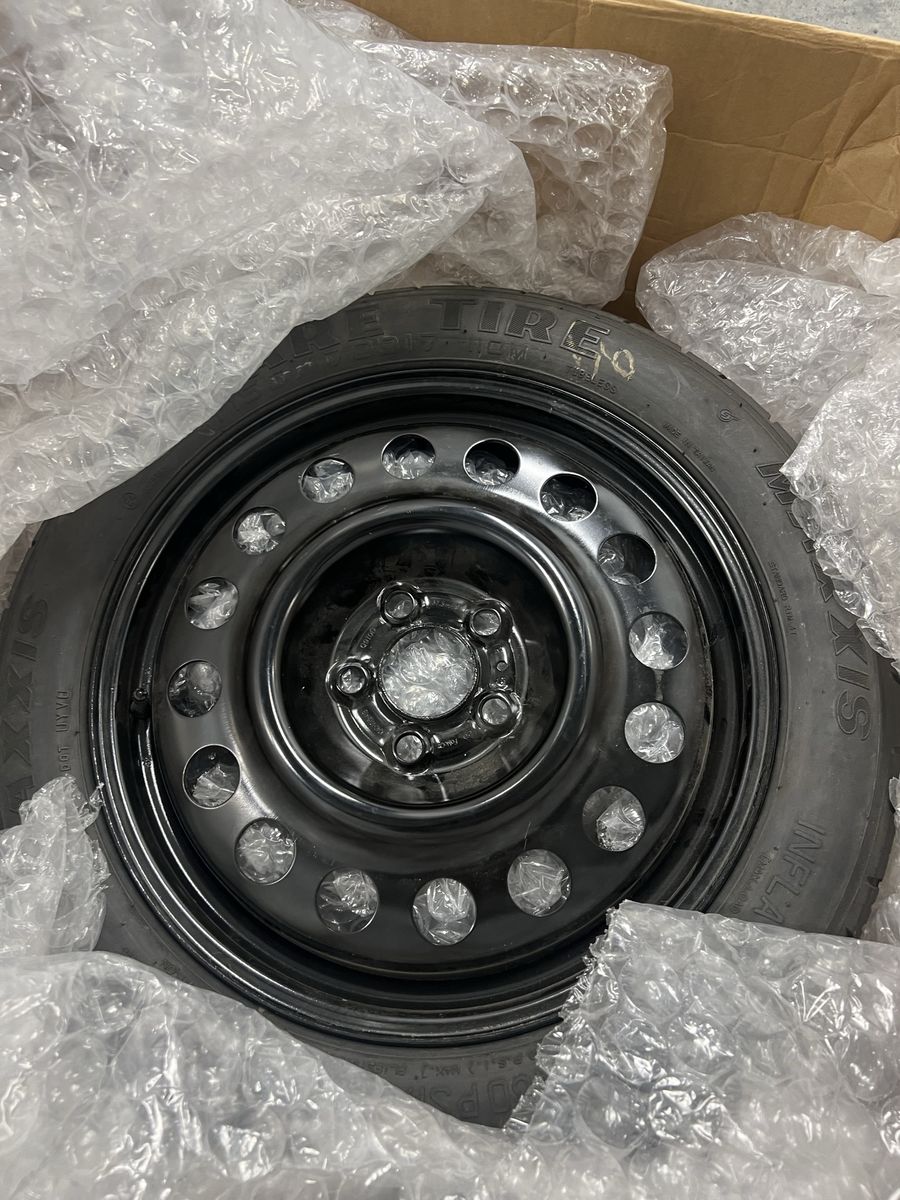 Maxxis Spare Tire on Black Steel Wheel with Scissor Jack