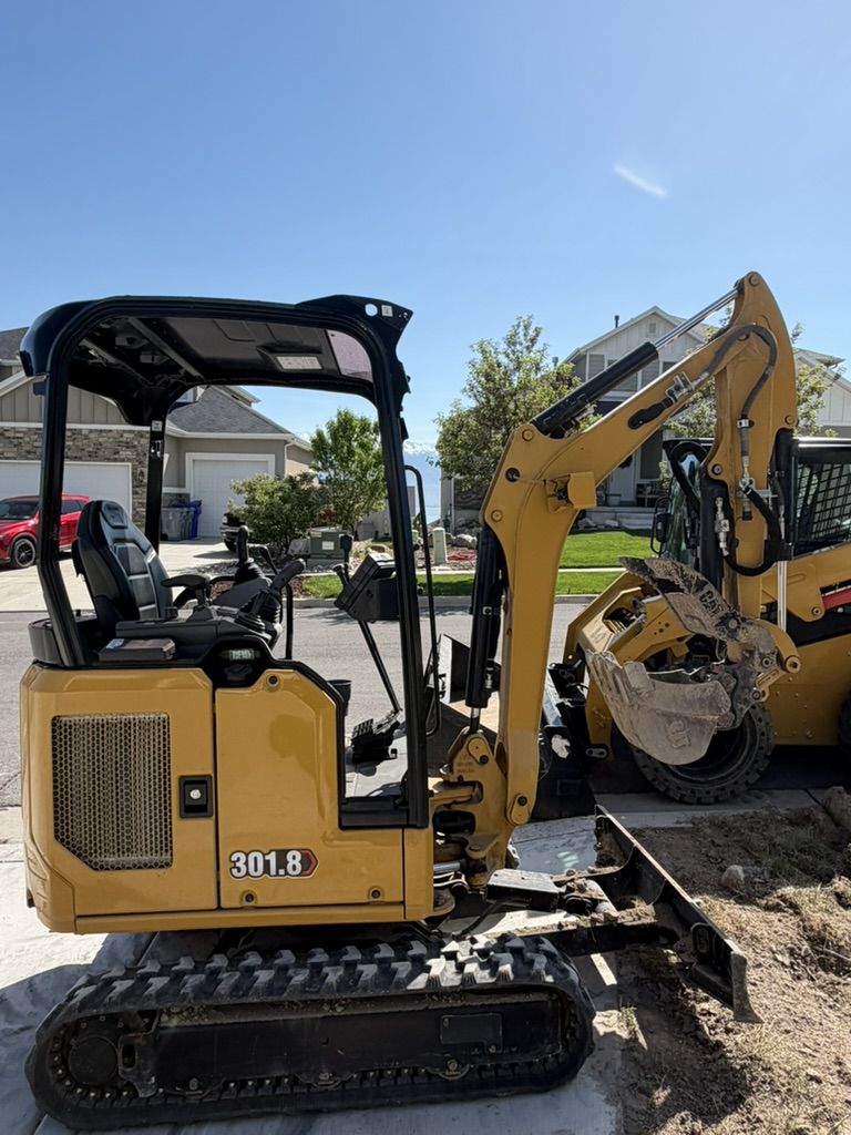 Cat 302 & Cat 301.8 Mini Excavators for Rent - Compact Excavators for Backyard Access