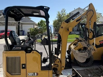 Cat 302 & Cat 301.8 Mini Excavators for Rent - Compact Excavators for Backyard Access