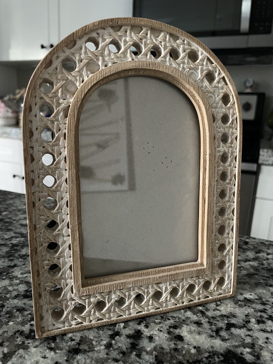 arched, whitewashed wooden photo frame with a woven cane texture border and an inner arched window 8x6”