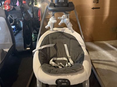 Graco Glider LX Gliding Baby Swing - Affix Infant Seat with 6 Speeds & Music, Removable Toy Bar