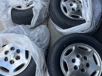Four - 15 Inch Wheels and 215/70R15 Tires