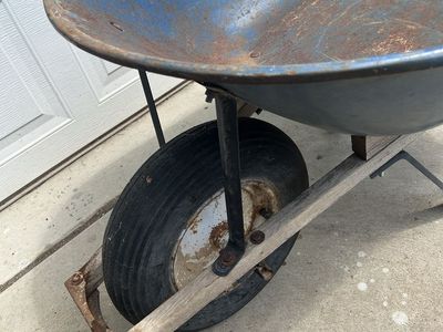 Blue Steel Wheelbarrow with Wooden Handles and Pneumatic Tire
