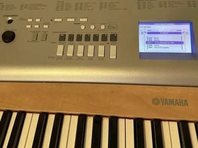 Yamaha YPG-635 88-Key Weighted Portable Grand Piano/ keyboard with AC adapter, music holder, pedal, and stand.