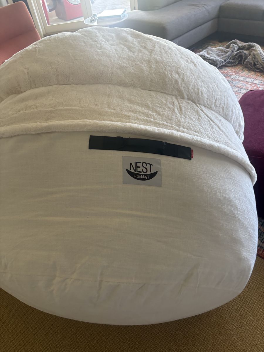 Large white been bag chair. Also folds out into a bed