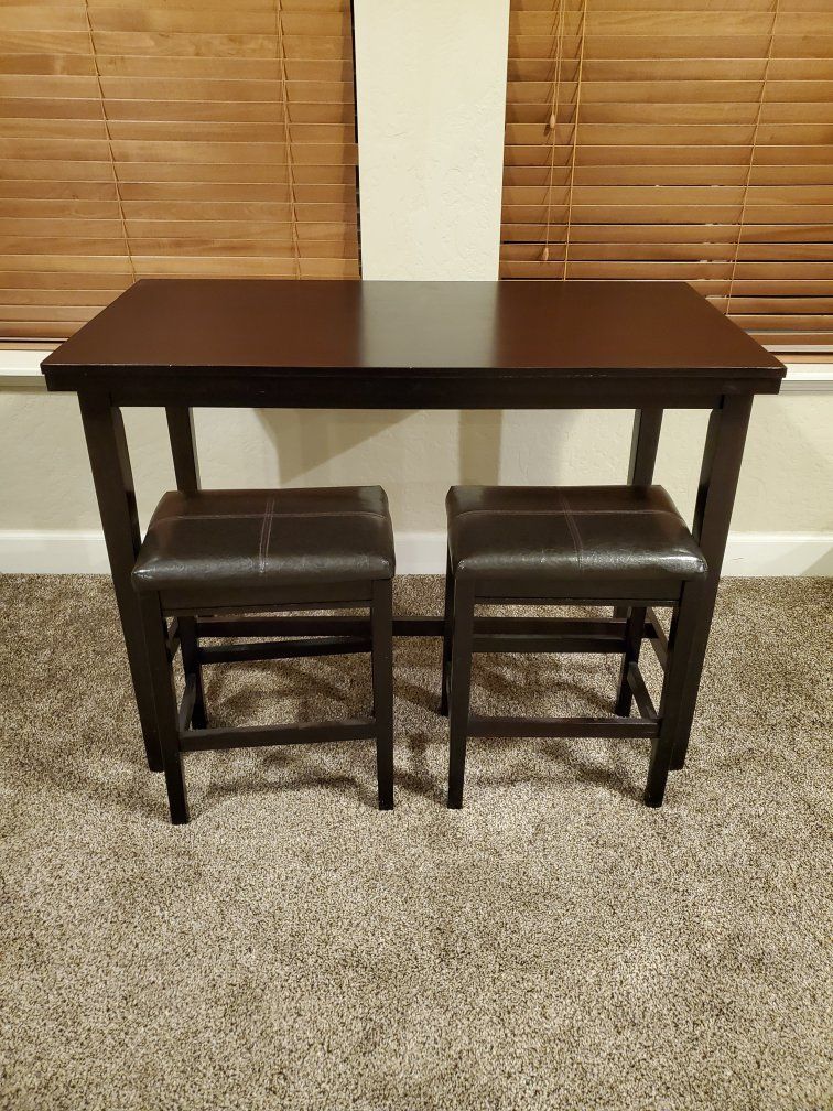 Counter height table with stools
