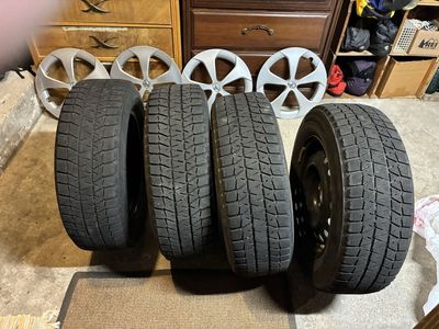Four Good Snow Tires Mounted On 15 Inch Rims