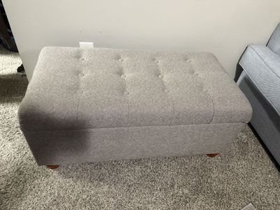 Grey/sandy bench with storage
