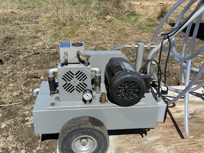 Portable Milking machine with buckets.