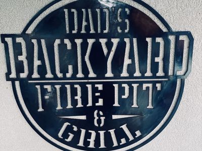 Dad's Backyard Fire Pit & Grill Metal Sign - Outdoor Wall Decor for BBQ Area