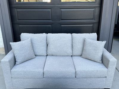 Light Grey Fabric Sofa with Matching Pillows and Ottoman