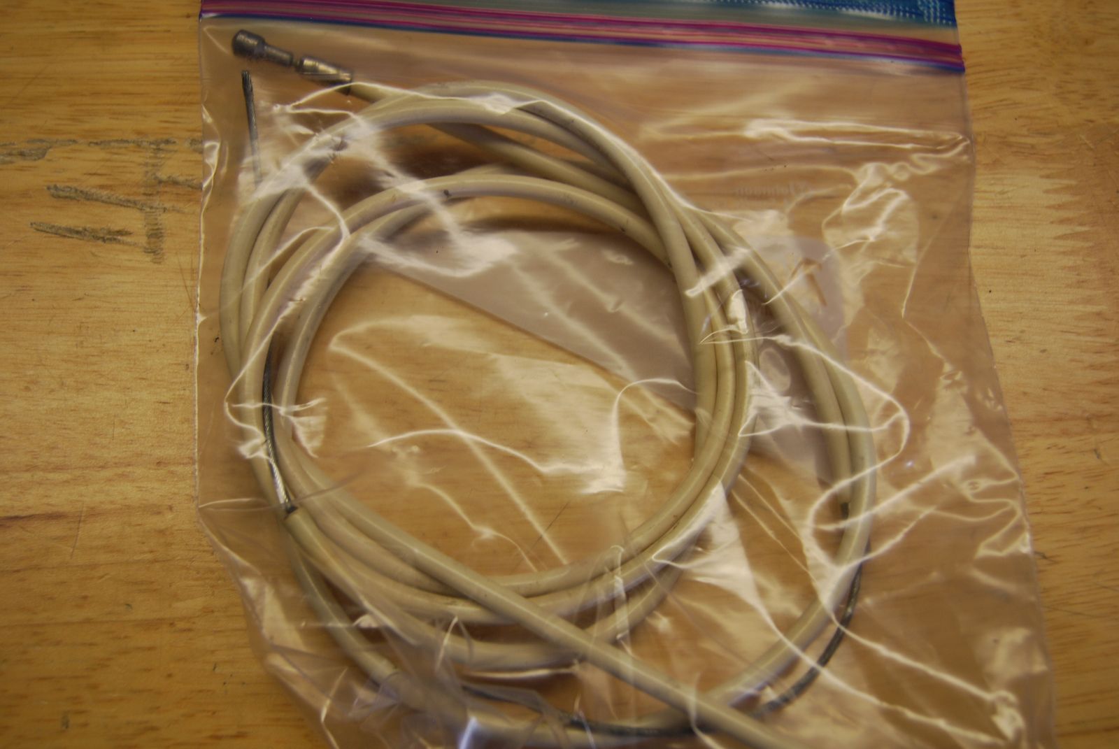 White brake cable and housing from an old Raleigh.