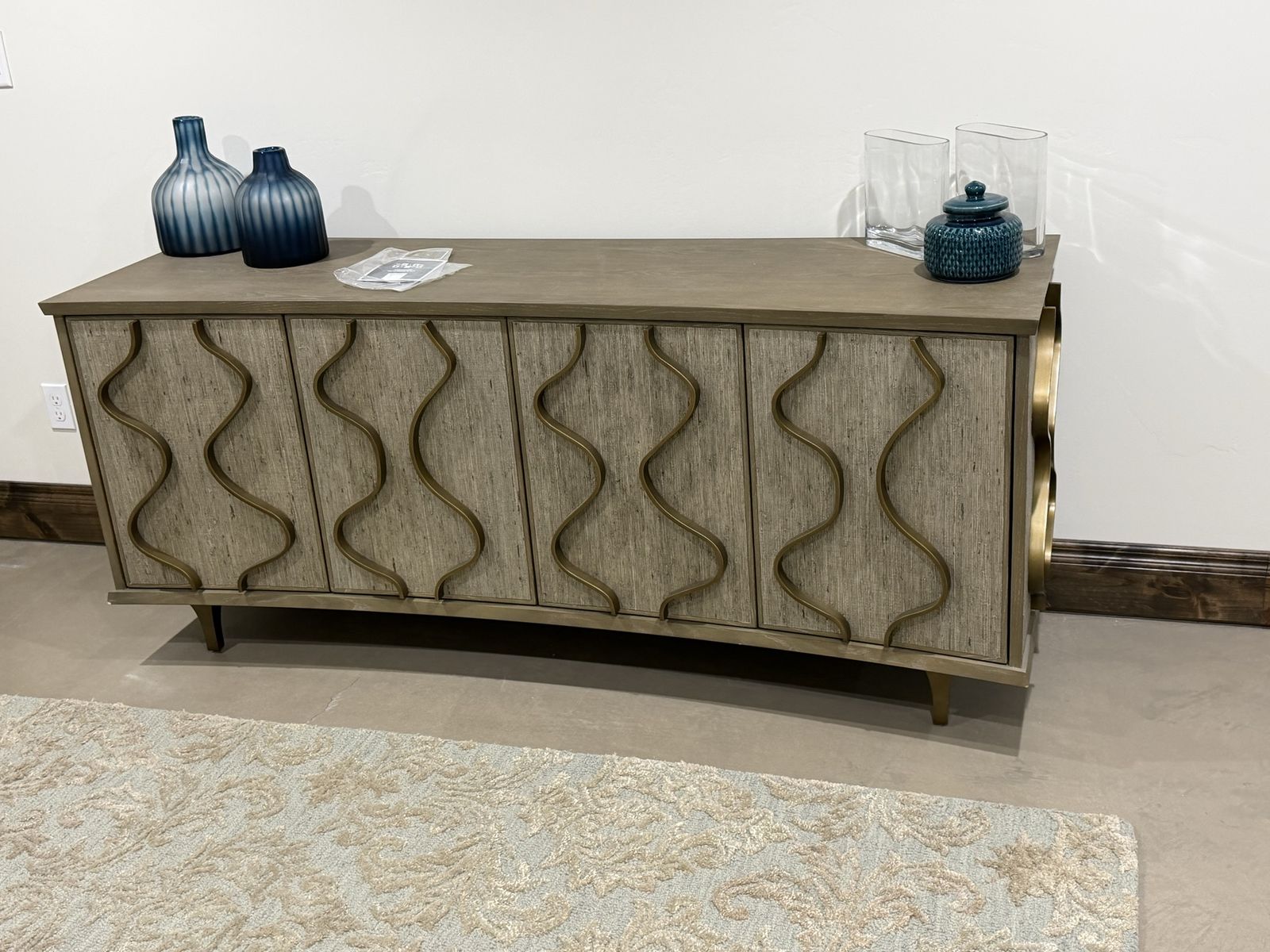 Modern Wooden Credenza Buffet with Wavy Gold Accents and Storage Shelves