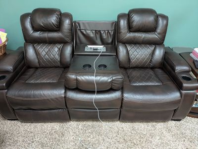 Leather couch and loveseat with four recliners all electric