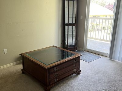 Solid wood coffee table with display drawer