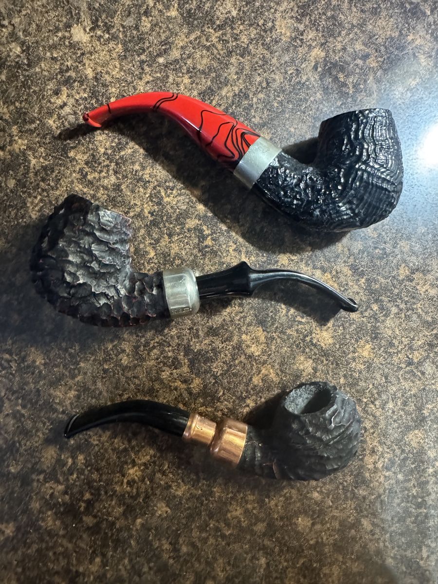 3 Peterson tobacco pipes with bags and boxes. Newish