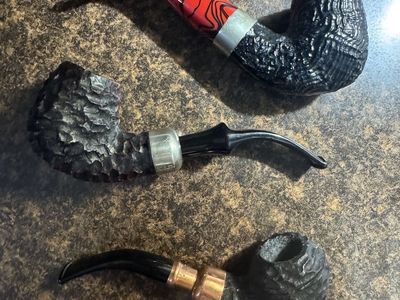 3 Peterson tobacco pipes with bags and boxes. Newish