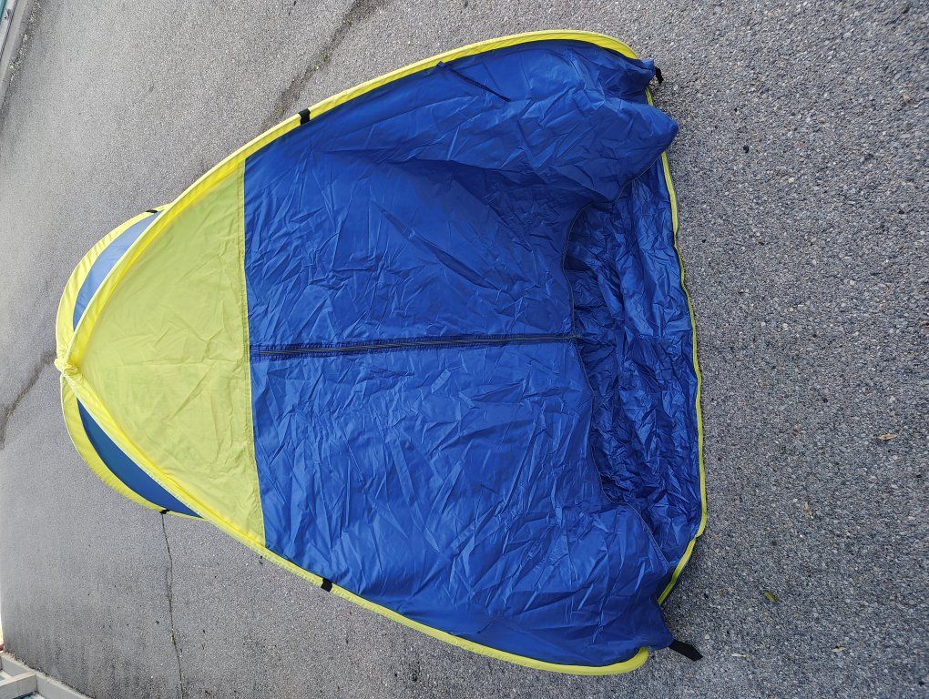 pop-up tent in its carrying case.