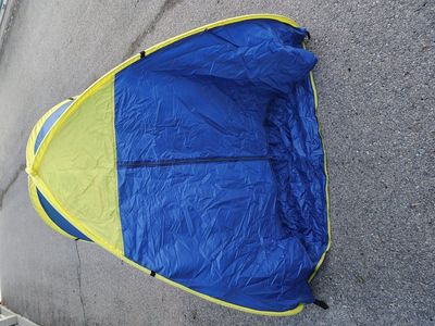 pop-up tent in its carrying case.