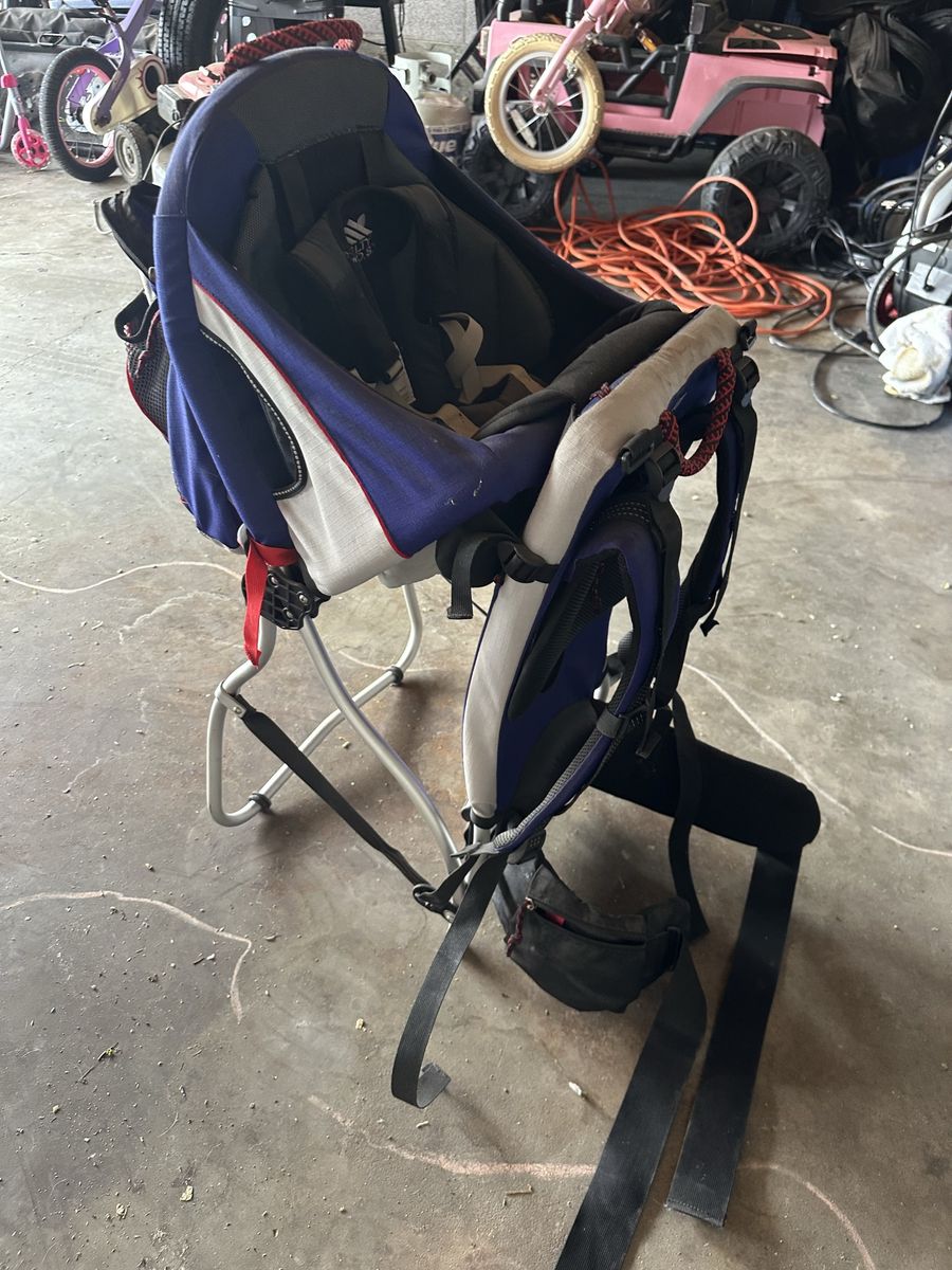 Child hiking carrying pack