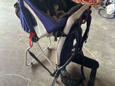 Child hiking carrying pack