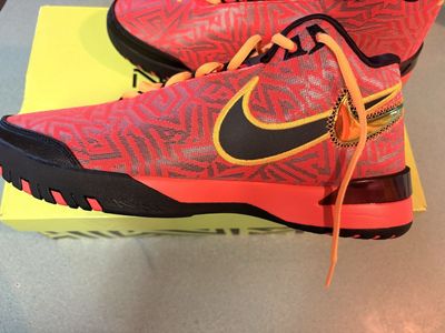 These are Nike LeBron NXXT Genisus 10.5M basketball shoes featuring a vibrant bright crimson mesh upper with geometric patterns