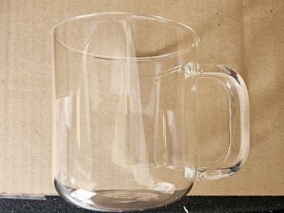 2 glass coffee cups and grinder