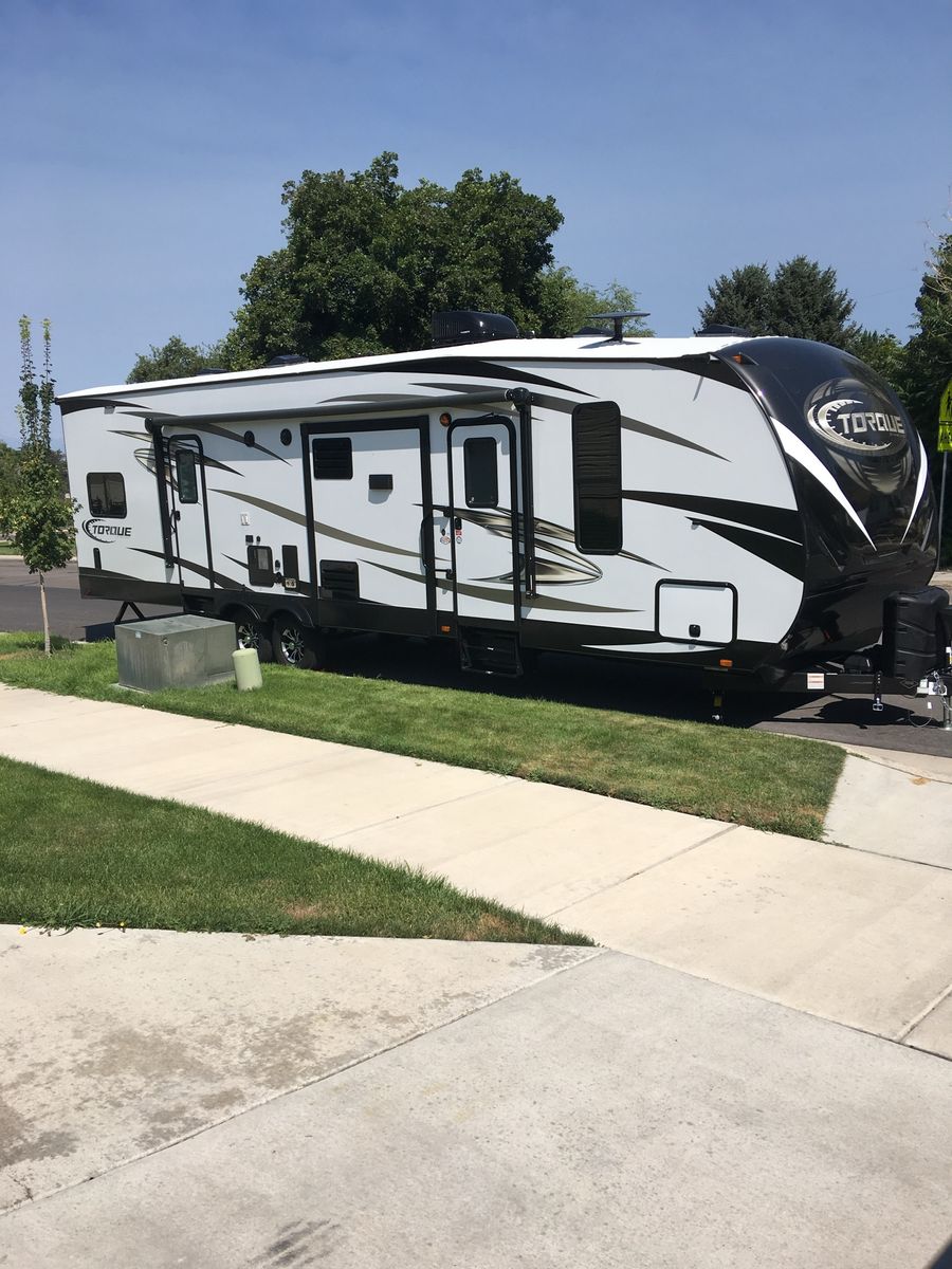 Heartland Torque T31 Toy Hauler Travel Trailer - Sleeps 7, 37' 9" Length, 19' Awning