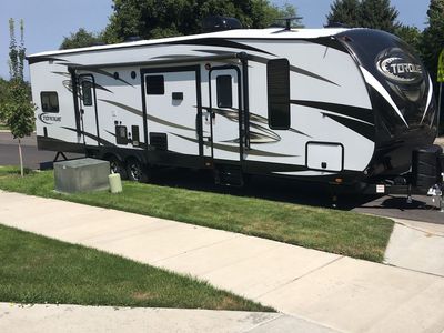 Heartland Torque T31 Toy Hauler Travel Trailer - Sleeps 7, 37' 9" Length, 19' Awning