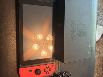 Nintendo Switch Console with Dock and power cord- Play On The Go or At Home