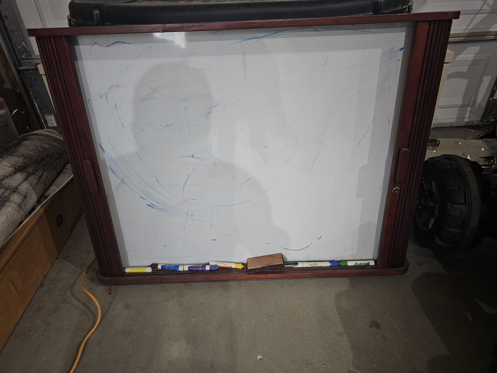 Large white board with sliding doors