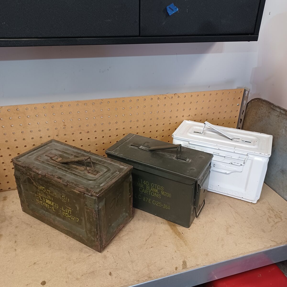 Metal ammunition cans.