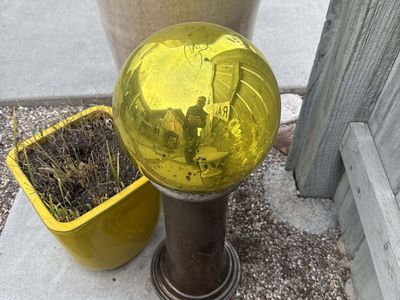 Glass Yard Orb on Concrete Pedestal Gold Amber