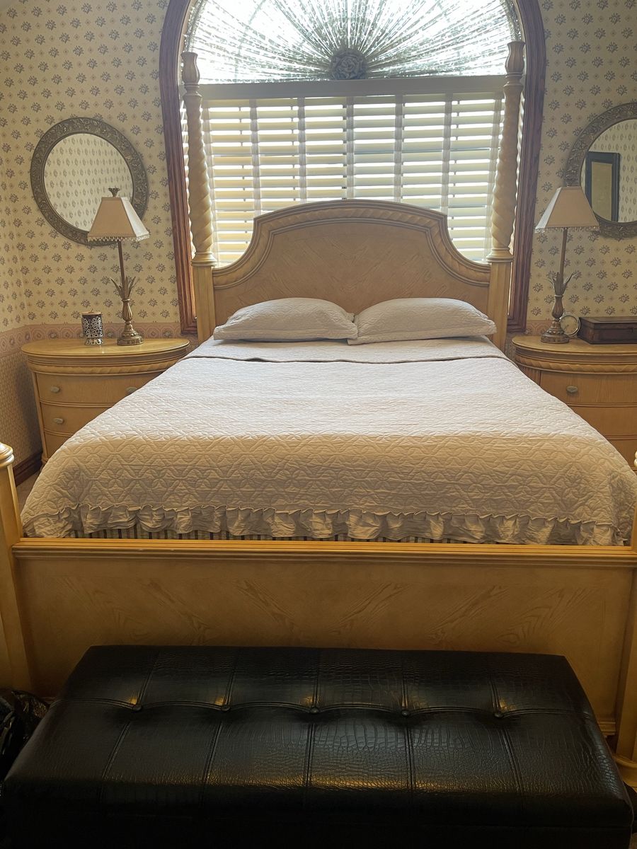 Elegant queen Size Wooden Poster Bed Frame with Intricate Carved Columns and Headboard, two night stand and wardrobe.