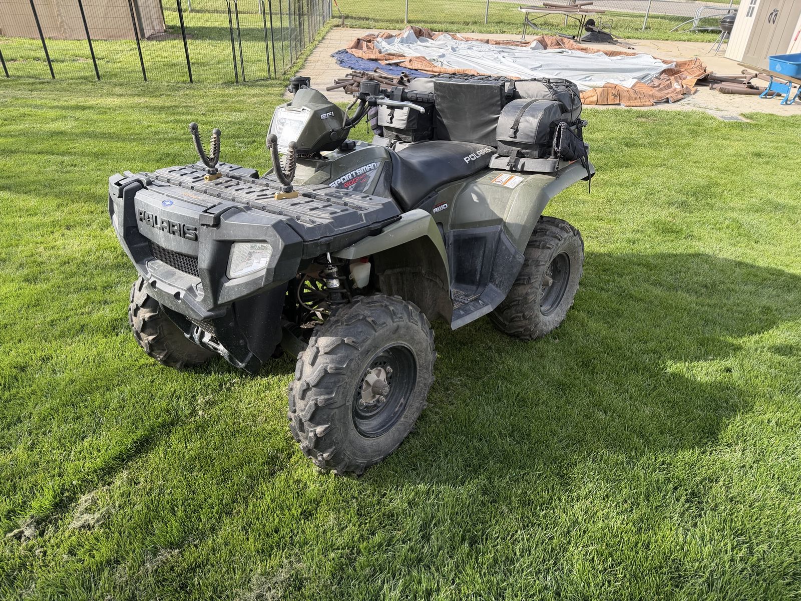 2009 Polaris Sportsman 800, gun rack and game bags.