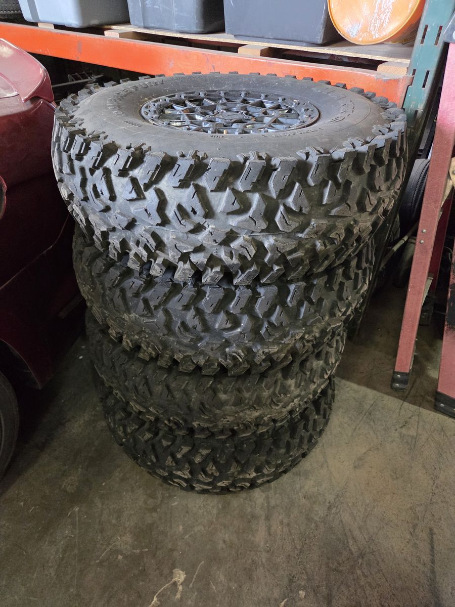 Side by side wheels & tires they are off a machine that was only used for 3 days then went bigger