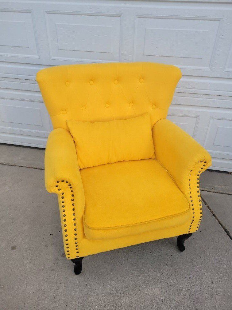 yellow upholstered arm chair