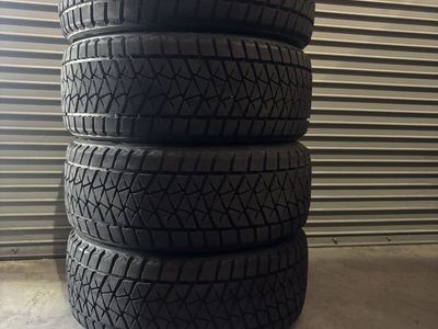 4 Bridgestone Blizzak DM-V2 Snow Tires — 285/45 R22 | 12/32nds | Set of 4