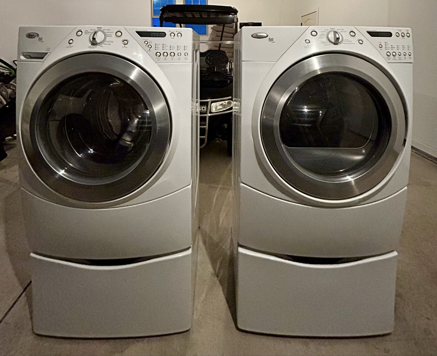 Whirlpool Duet Steam Front Load Washer and Dryer Set with Pedestals. 